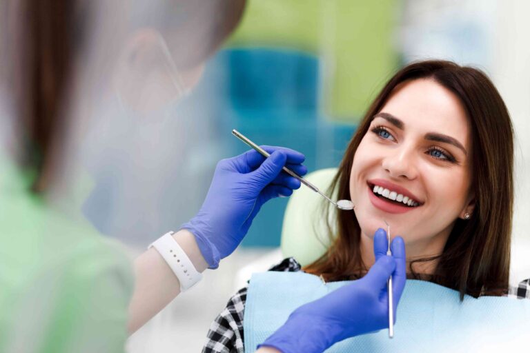 Smiling patient during a dental exam.