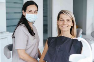 Smiling patient with dental professional