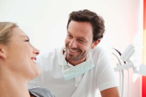 Dentist reassuring patient during consultation