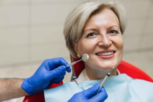 Smiling patient during a dental exam.