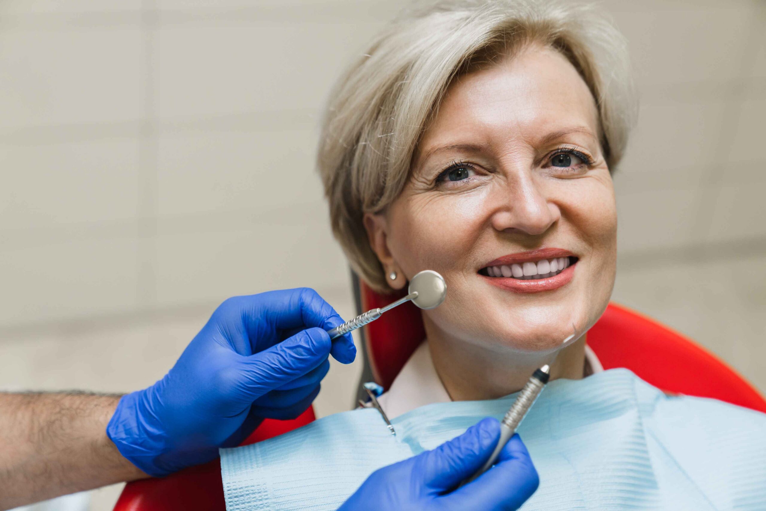 Smiling patient during a dental exam.