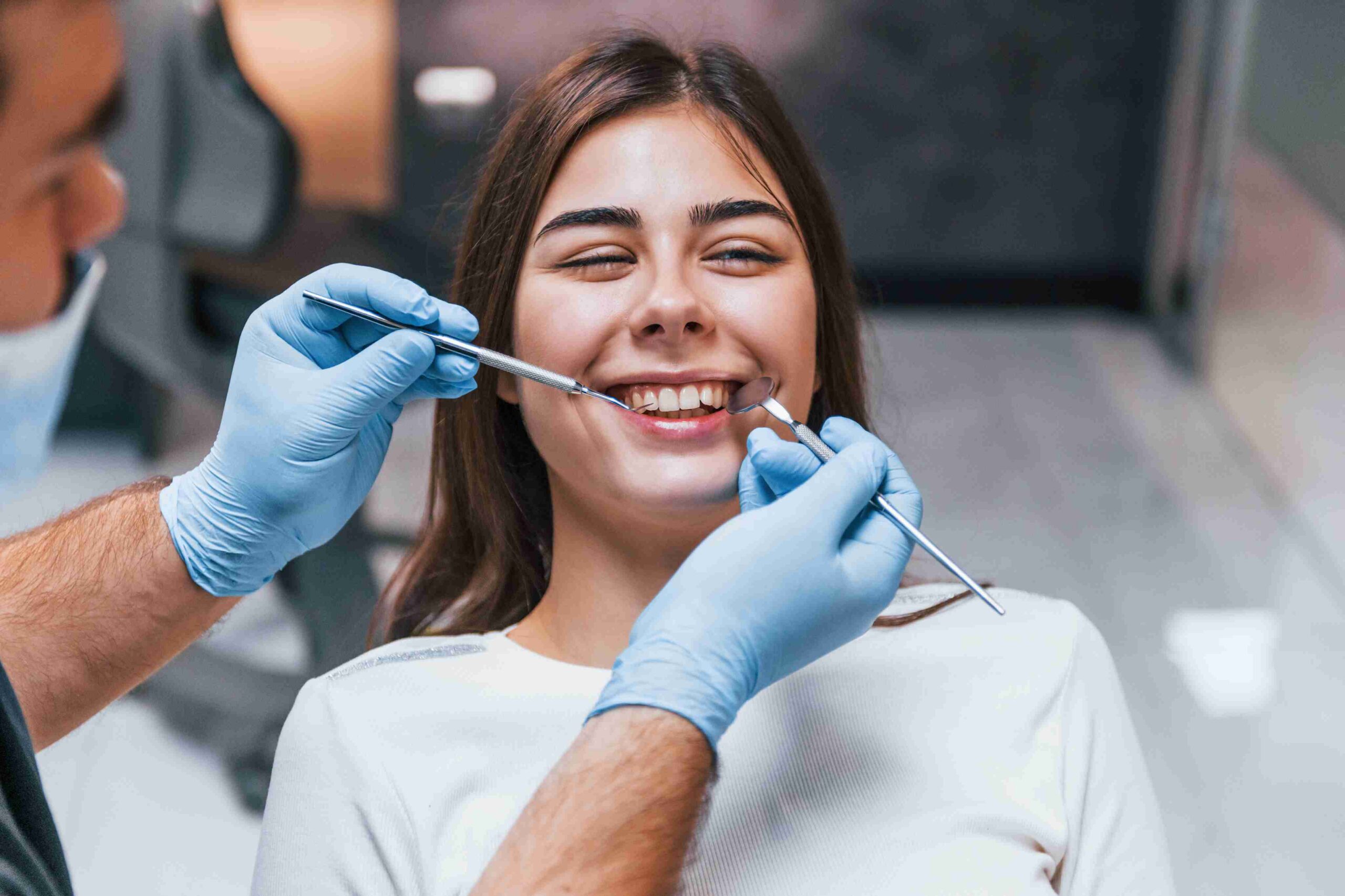 Patient smiling during a dental checkup.